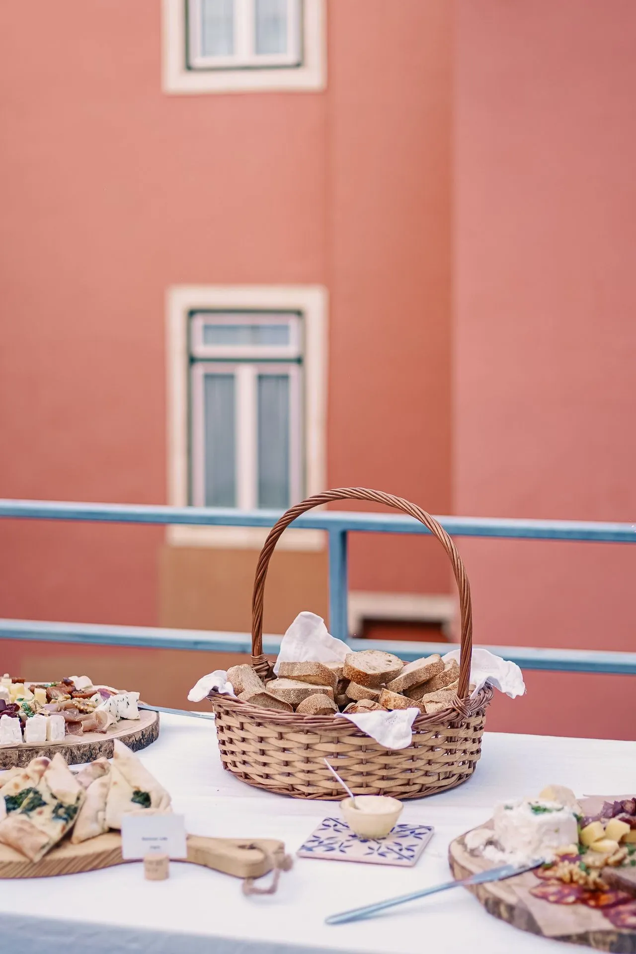 Fresh bread and cheese on an outdoor table during a Lisbon food tasting tour